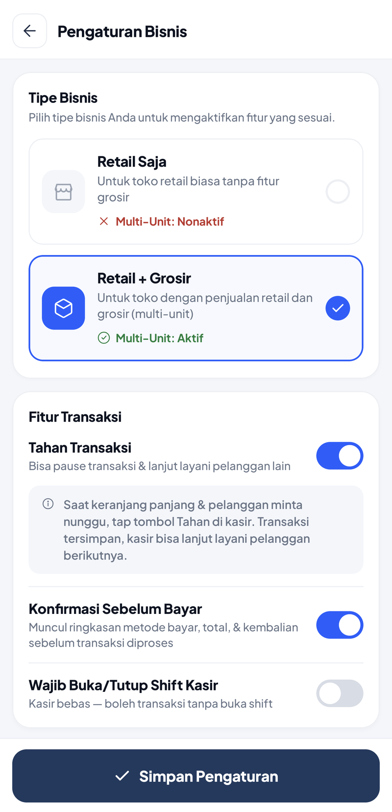 Pengaturan Bisnis bagian atas: kartu Tipe Bisnis dengan pilihan Retail Saja (Multi-Unit: Nonaktif) dan Retail + Grosir terpilih (Multi-Unit: Aktif); kartu Fitur Transaksi dengan Tahan Transaksi menyala beserta catatannya, Konfirmasi Sebelum Bayar menyala, Wajib Buka/Tutup Shift Kasir mati dengan tulisan Kasir bebas — boleh transaksi tanpa buka shift
